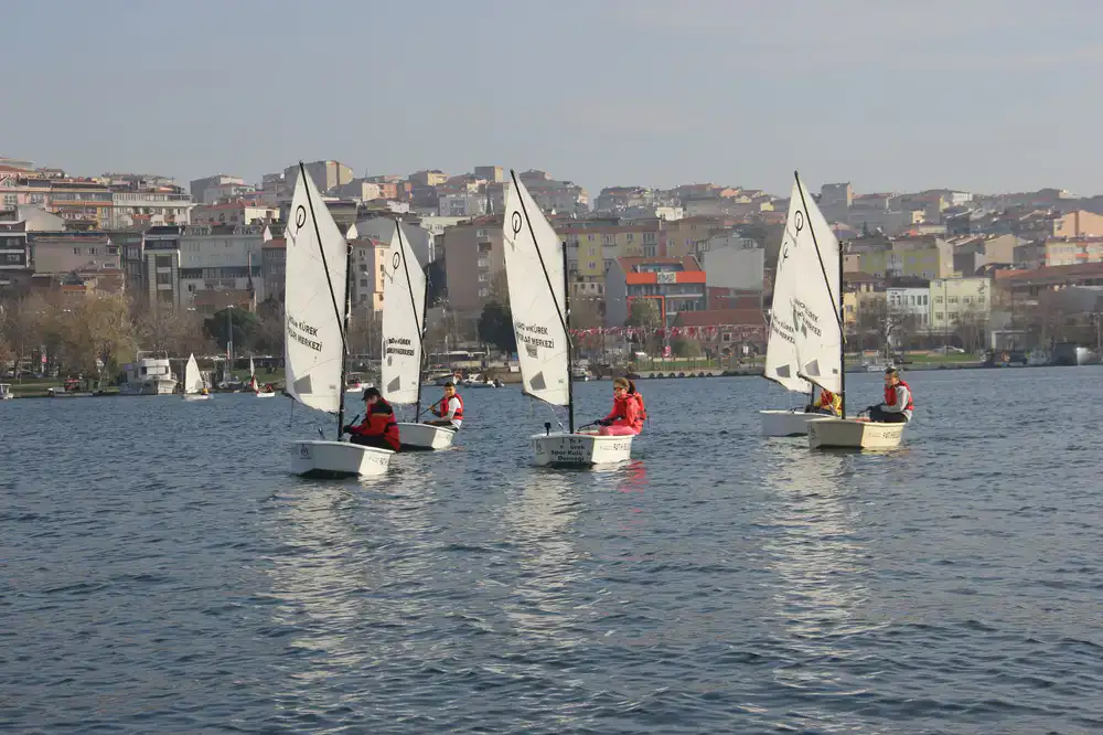 Instructor demonstrating sailing basics to a student