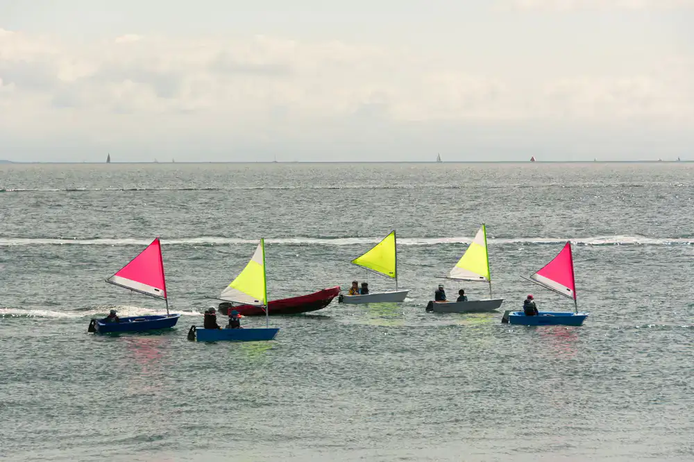 Beginner learning to sail on calm water