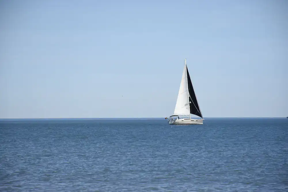 Sailboat navigating clear open waters