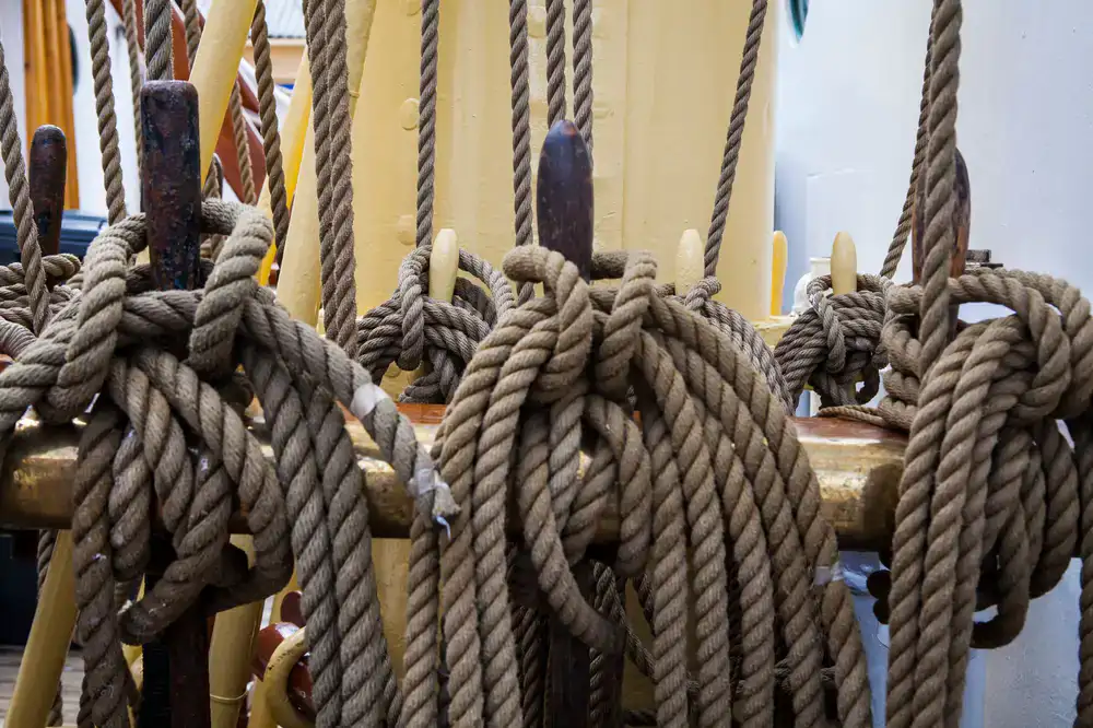 Instructor demonstrating knot tying on deck